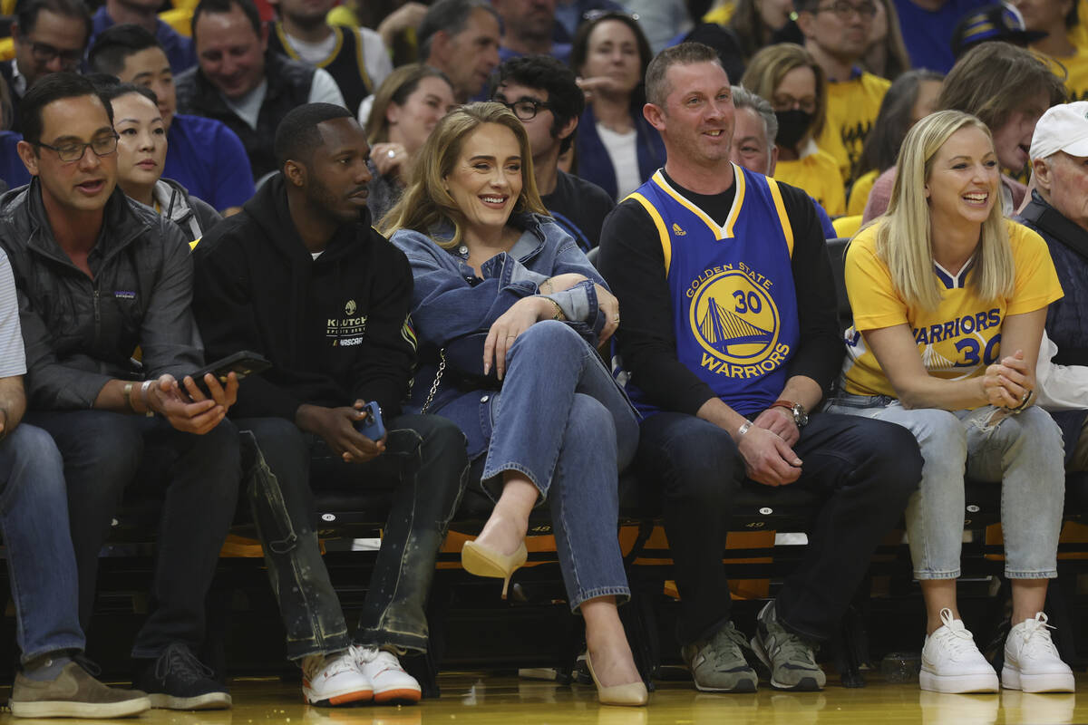 Adele, center, watches during Game 2 of the NBA basketball playoffs Western Conference finals b ...