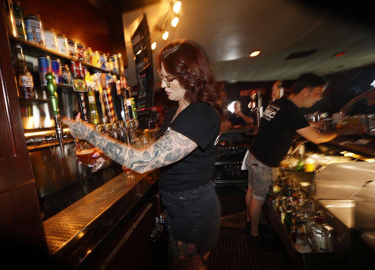 Devin Costentine, Atomic Liquors lead bartender pours Joseph James Suave Felon #003 into a glas ...