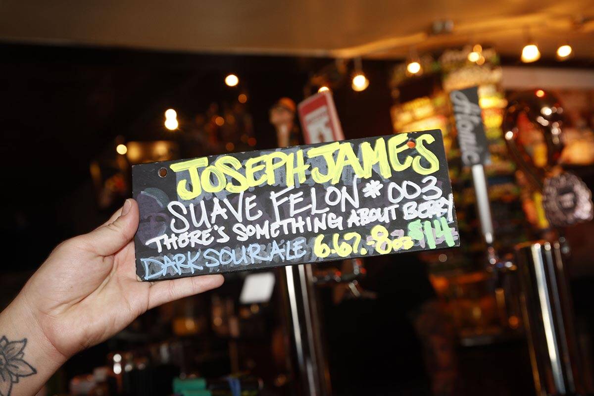 A new tag of Joseph James Suave Felon #003 is seen at Atomic Liquors, Saturday, June 18, 2022, ...
