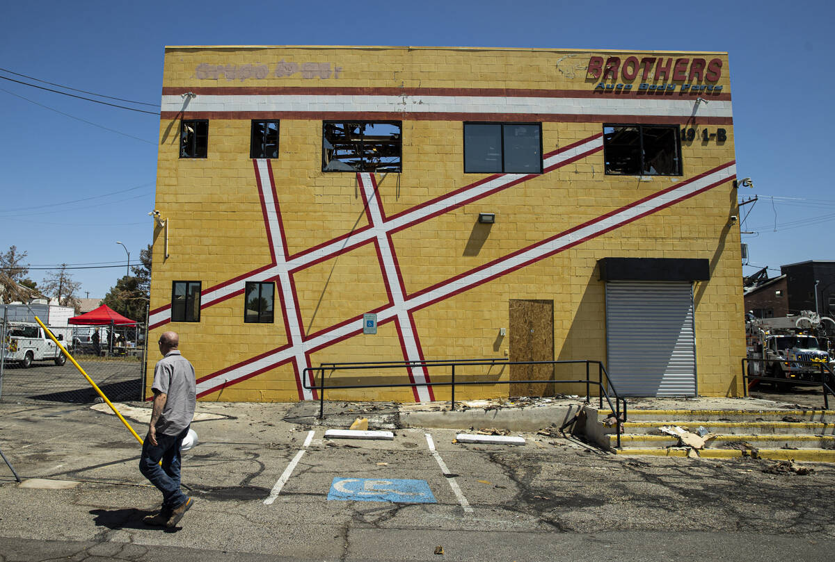 A damaged Brothers Auto Body Parts building is seen in the area where a fire damaged or destroy ...