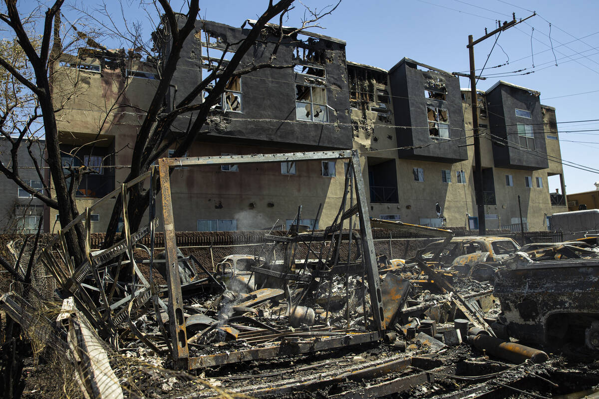 Damage and debris in the yard of Perfect Auto Body, where more than 30 vehicles where destroyed ...