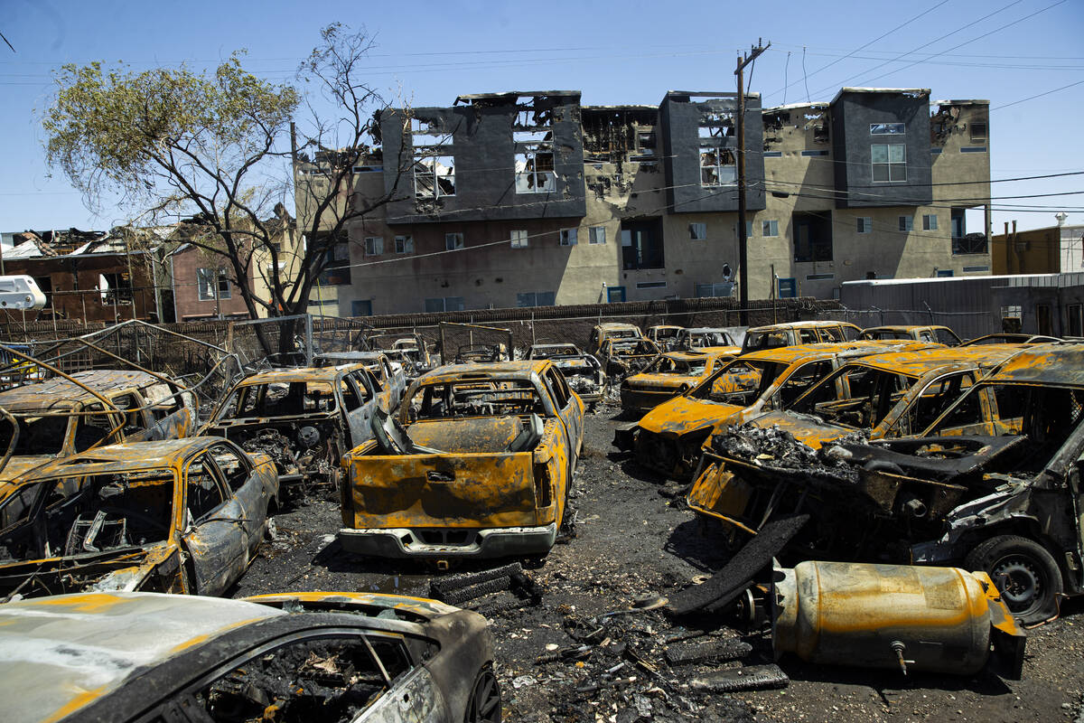 Damage and debris in the yard of Perfect Auto Body, where more than 30 vehicles where destroyed ...