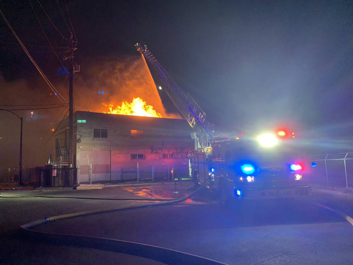 Firefighters try to extinguish a fire, Sunday, June 19, 2022, in downtown Las Vegas. (Las Vegas ...