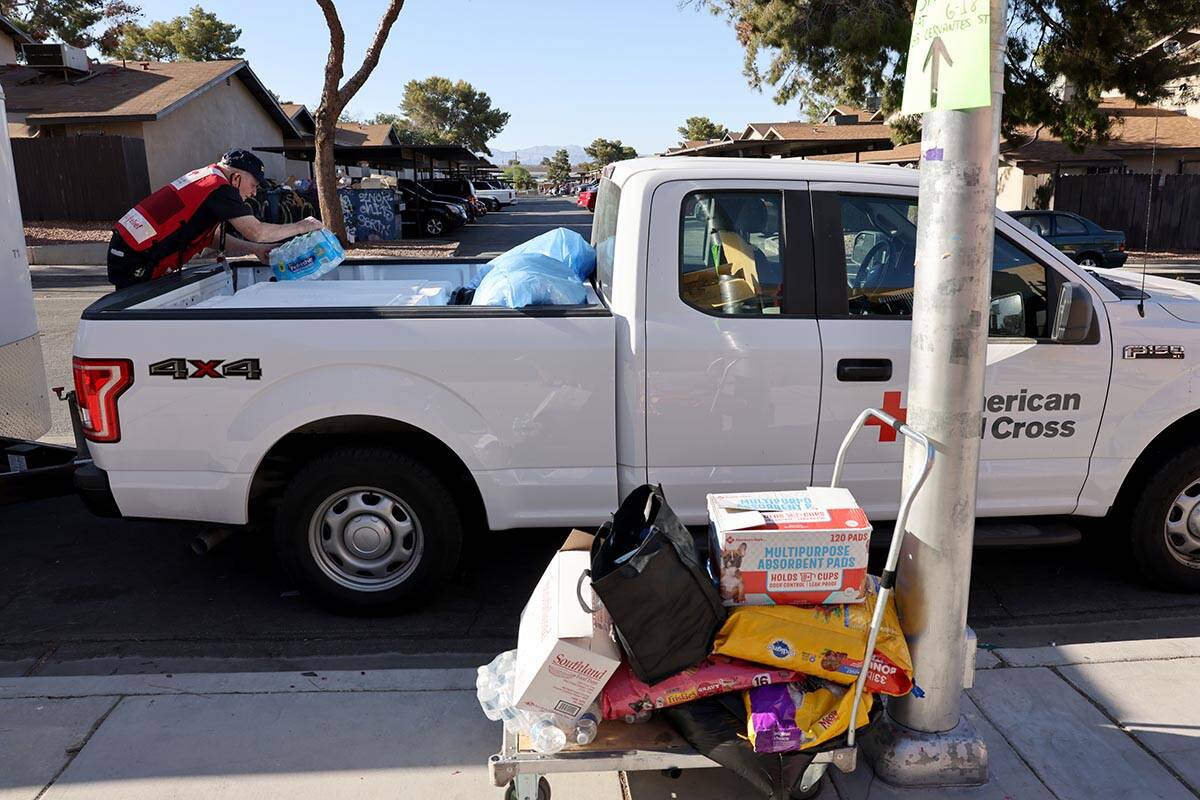 American Red Cross volunteer Pat Moore loads supplies at an evacuation center at Hollingsworth ...