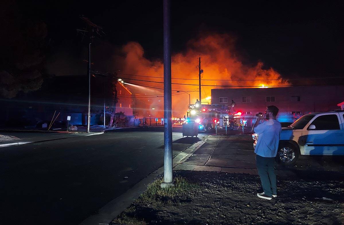 Flames from a structure near Fremont Street and Eastern Avenue in Las Vegas on Sunday, June 19, ...