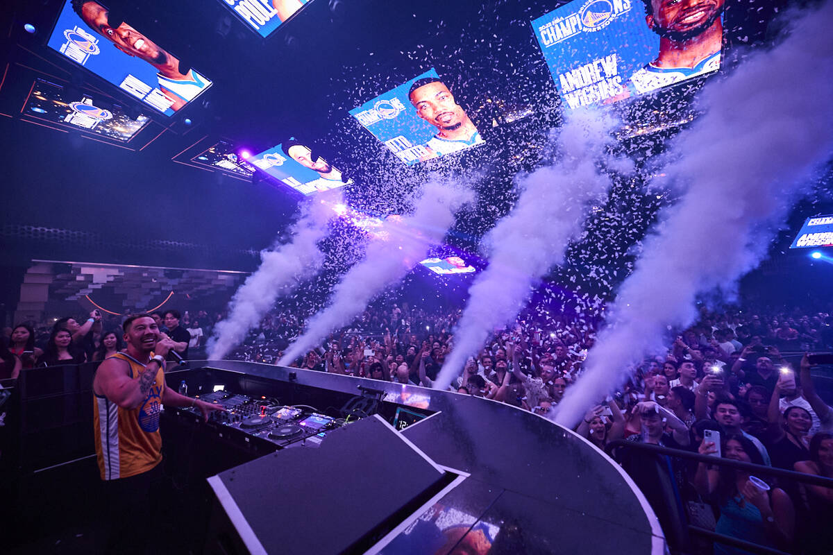 DJ Flight fires the party cannons as the Golden State Warriors celebrate their NBA championship ...