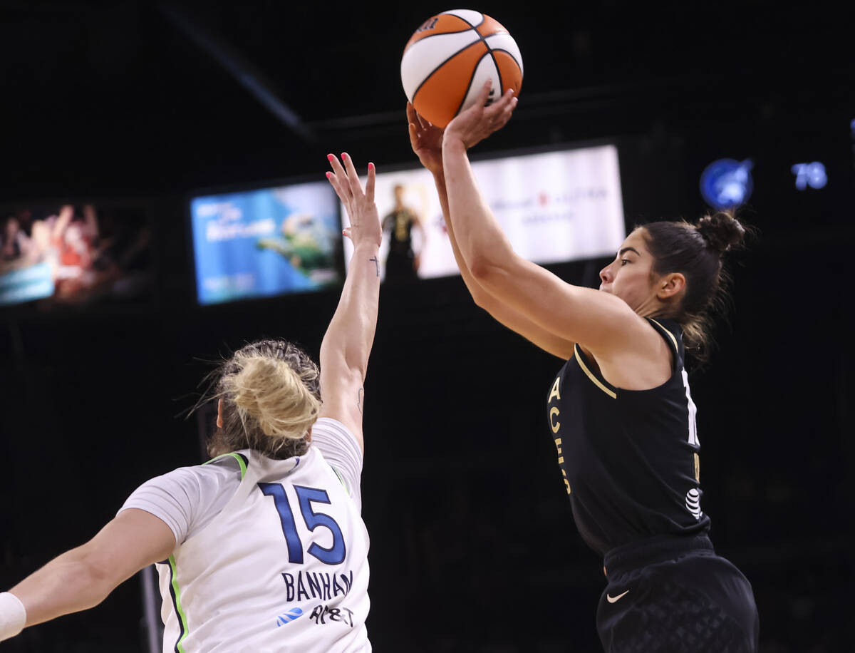 Las Vegas Aces guard Kelsey Plum (10) shoots over Minnesota Lynx guard Rachel Banham (15) durin ...