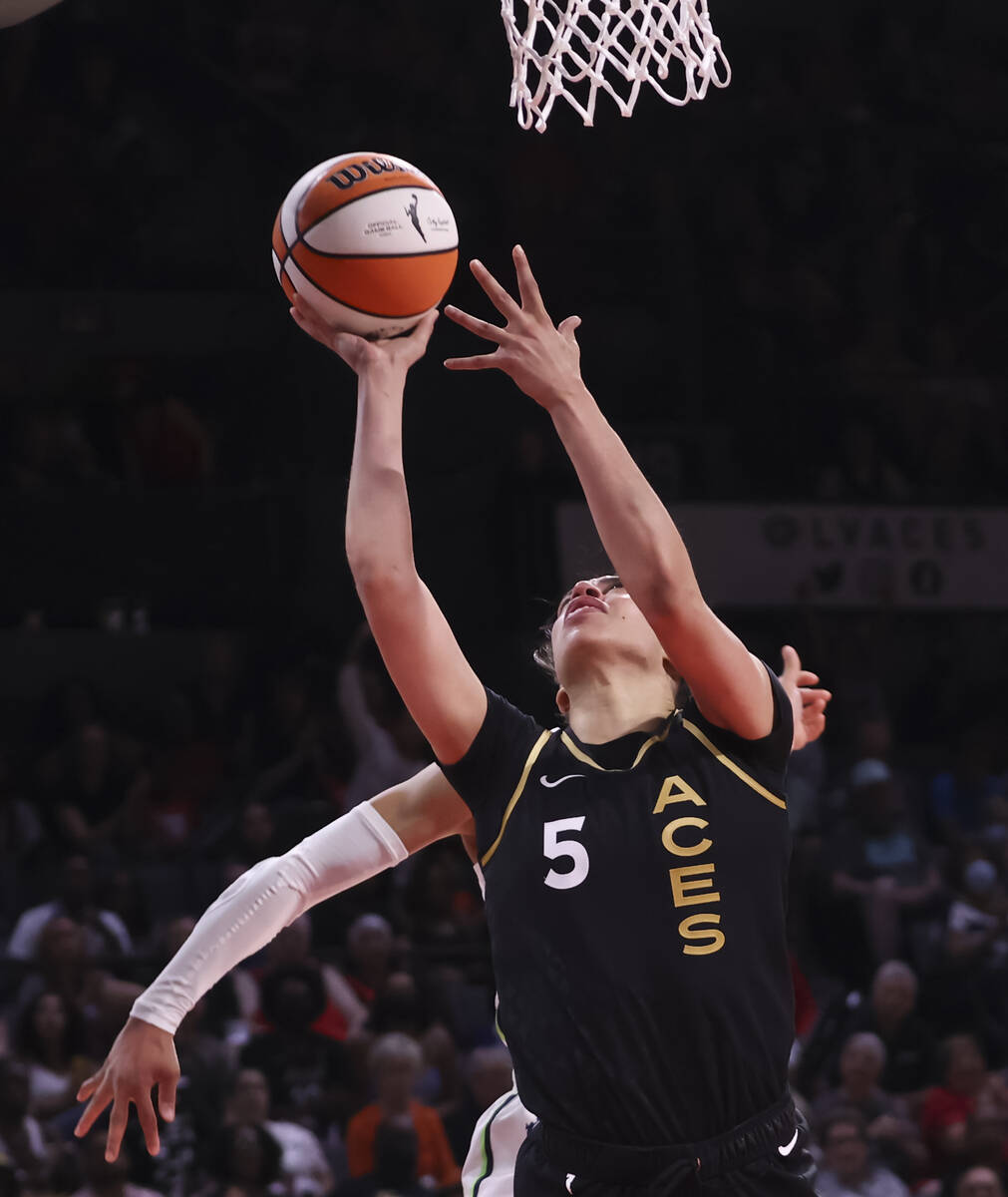 Las Vegas Aces forward Dearica Hamby (5) lays up the ball against the Minnesota Lynx during the ...