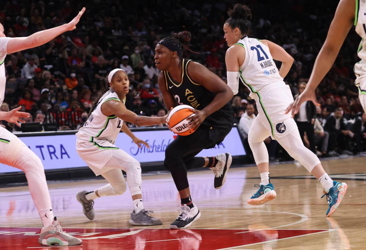 Las Vegas Aces guard Chelsea Gray (12) drives to the basket against Minnesota Lynx guard Moriah ...