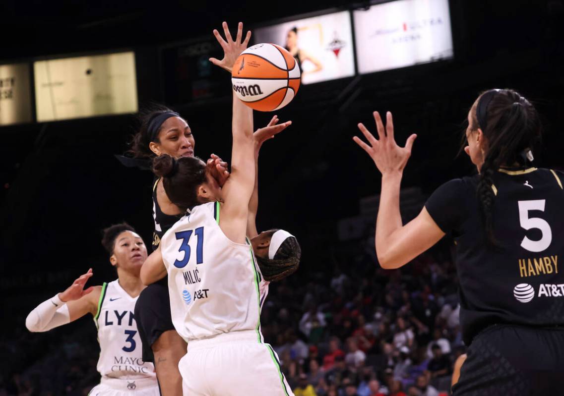 Las Vegas Aces forward A'ja Wilson (22) passes the ball over Minnesota Lynx center Nikolina Mil ...