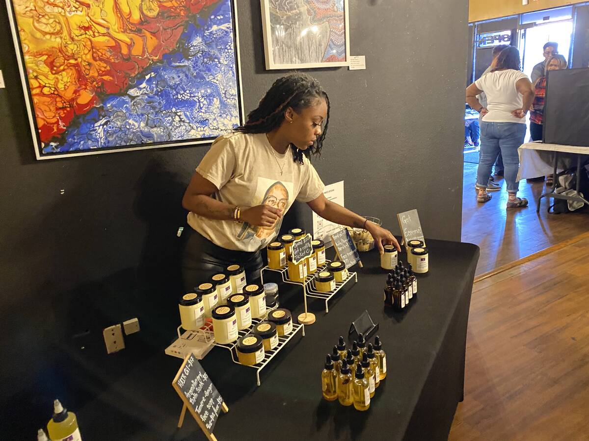Ty Hyatte, owner of Glow With Me, organizes her products at a pop up shop at The Art House Hook ...