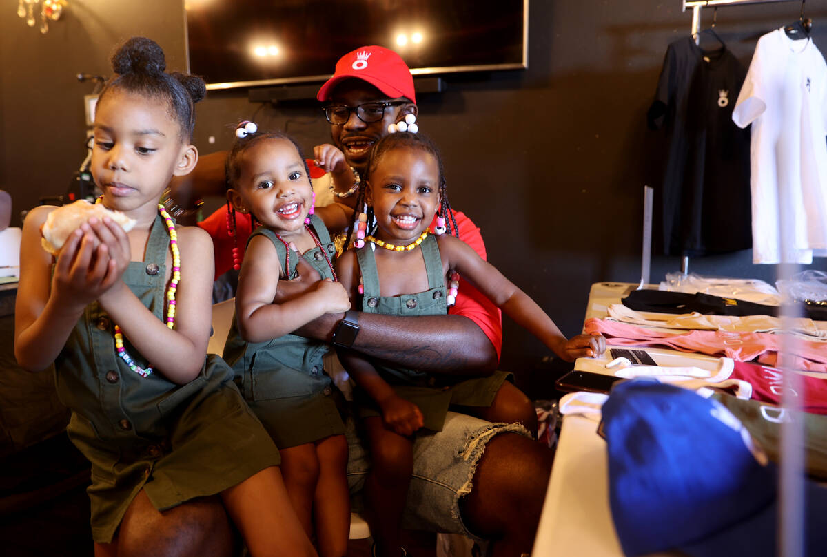 Devin Jones hangs out with his daughters, from left, Karri, 4, Kensley 2, and Klynn 3, during a ...