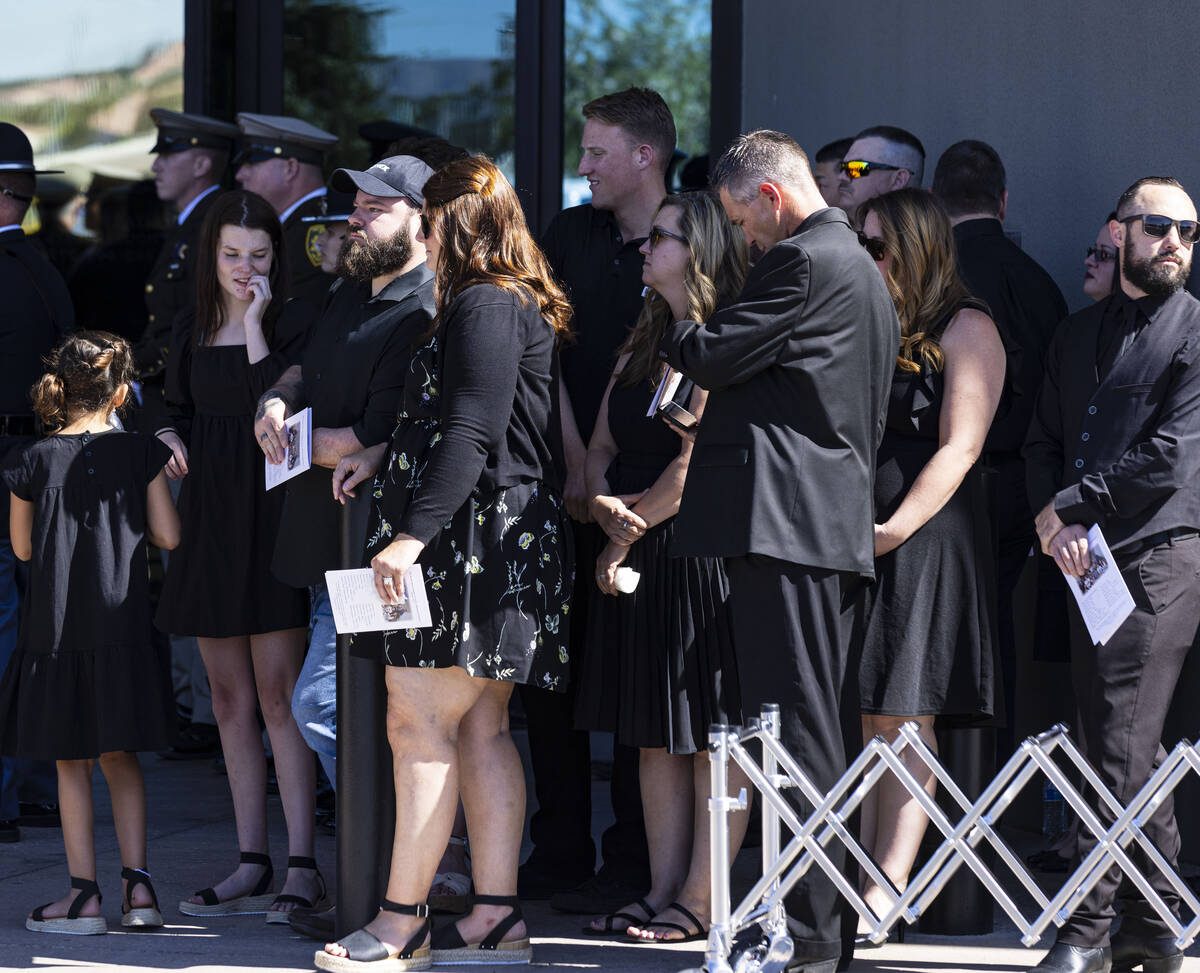 Family members gather outside Central Christian Church during the funeral for Las Vegas police ...