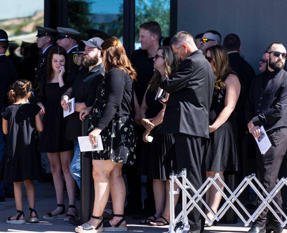 Family members gather outside Central Christian Church during the funeral for Las Vegas police ...