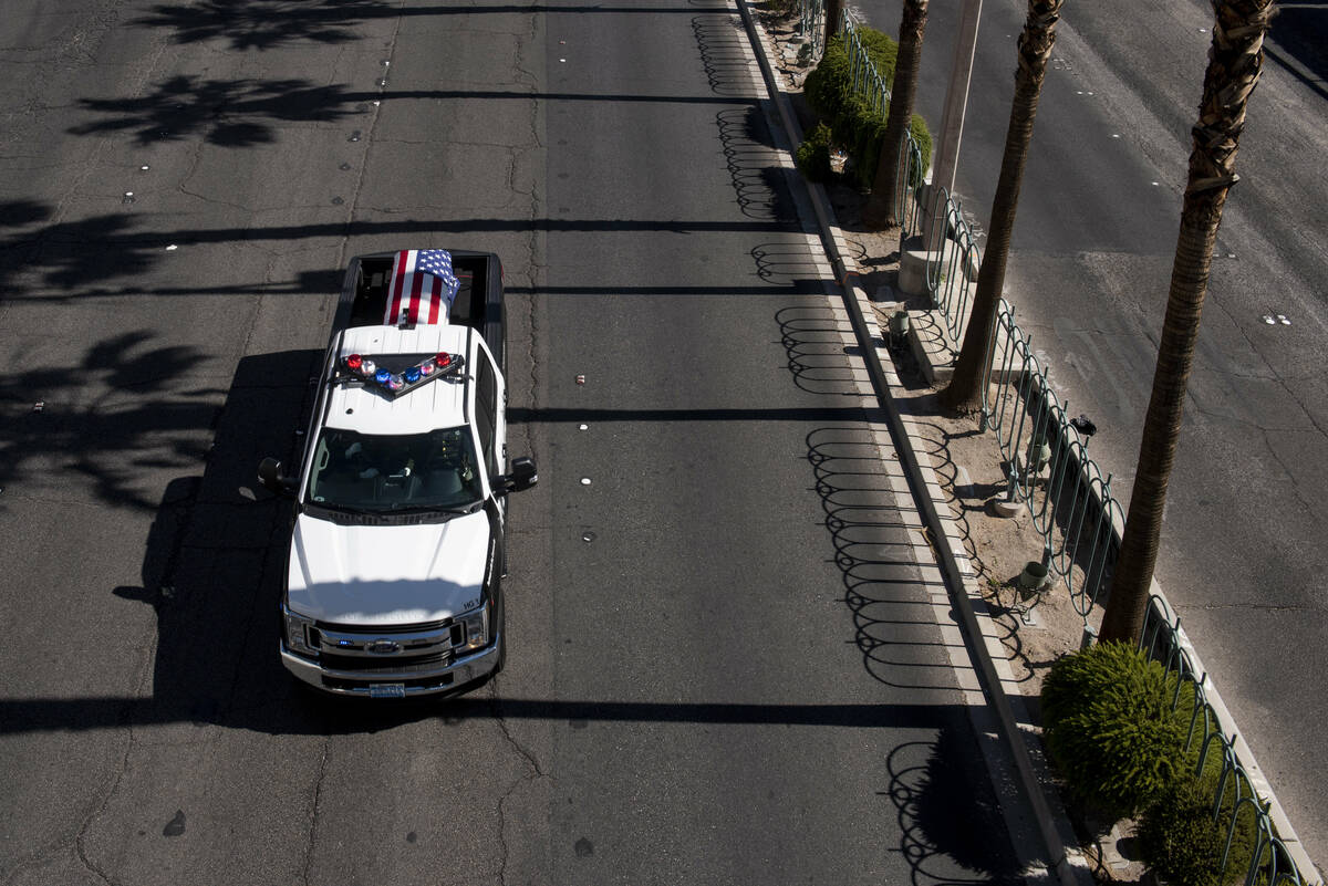 The funeral procession for Las Vegas police Detective Justin Terry heads southbound on Las Vega ...