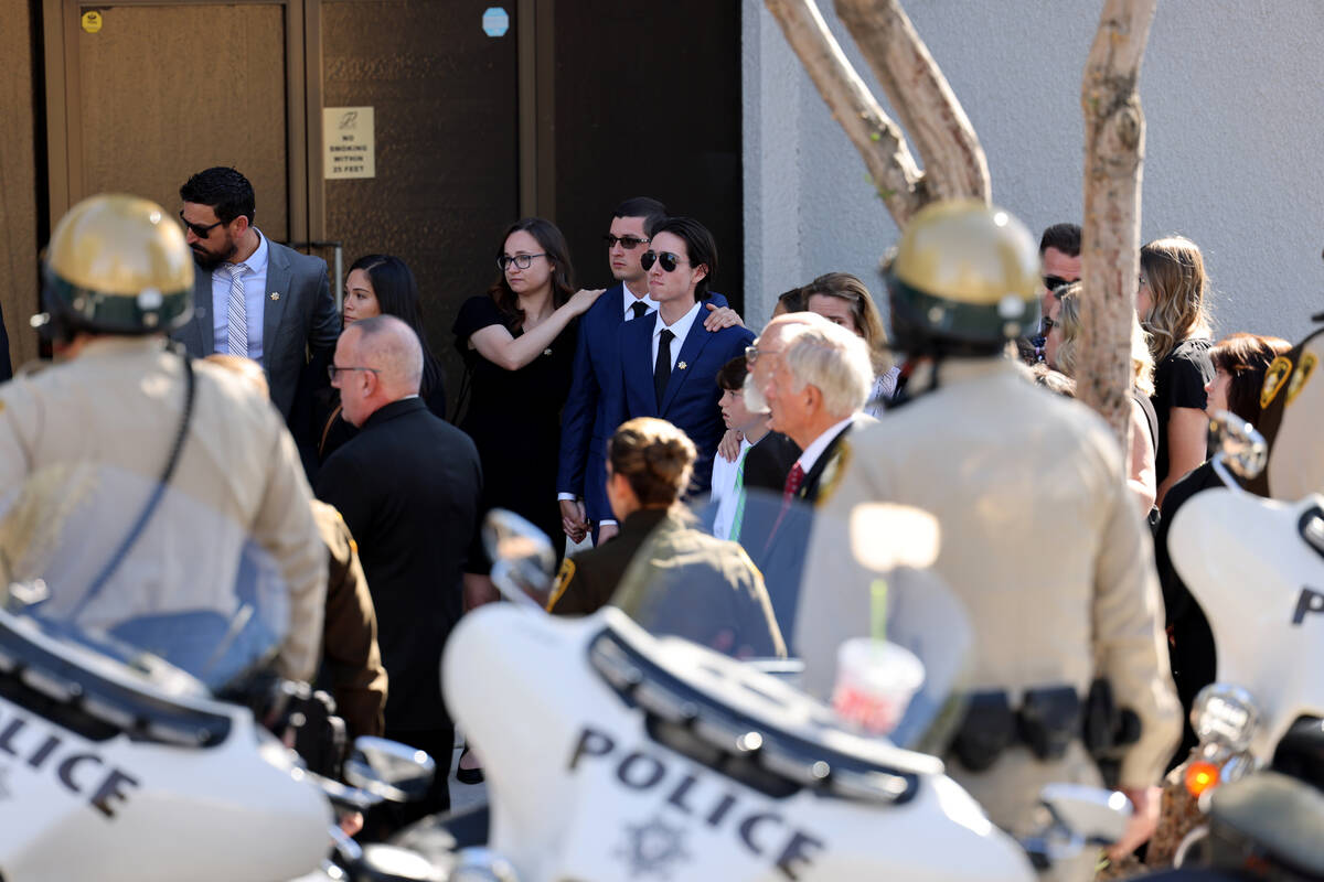 Family members of Las Vegas police Detective Justin Terry watch as a Metropolitan Police Depart ...