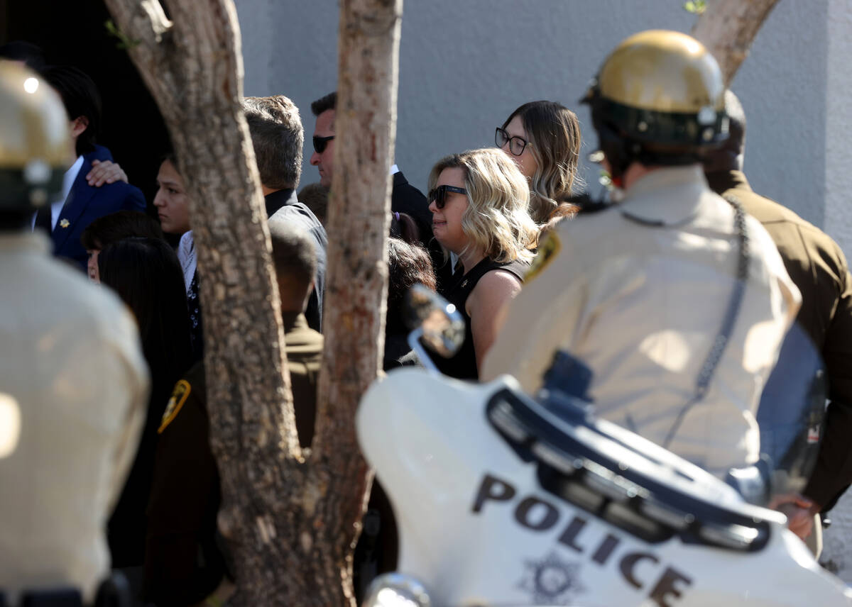 Family members of Las Vegas police Detective Justin Terry watch as Metropolitan Police Departme ...