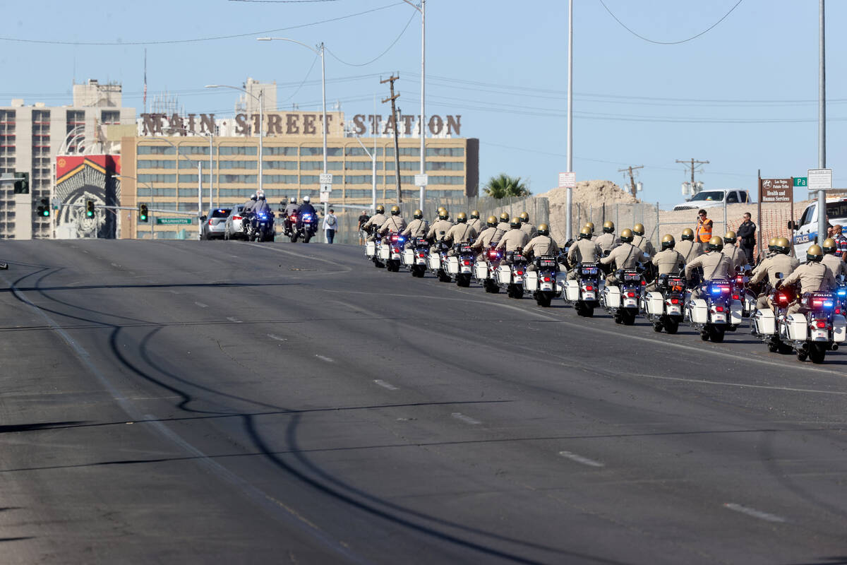 Metropolitan Police Department officers lead a procession for Las Vegas police Detective Justin ...