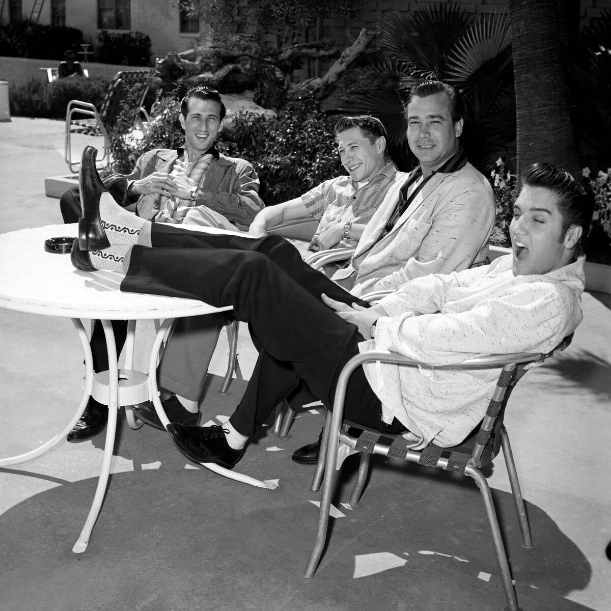 Drummer D.J. Fontana, left, guitarist Scotty Moore, bassist Bill Black and Elvis Presley relax ...