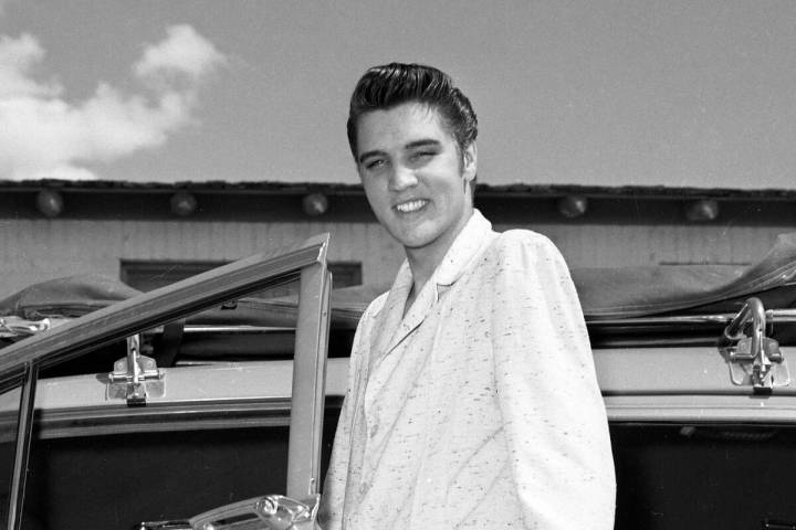 Elvis Presley poses outside a car during his first run of shows at the New Frontier on April 30 ...