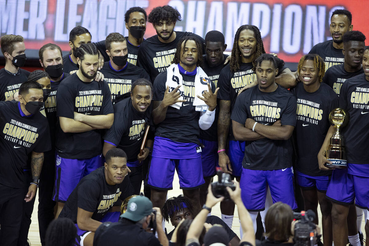 The Sacramento Kings pose for photos after beating the Boston Celtics in a NBA Summer League ch ...