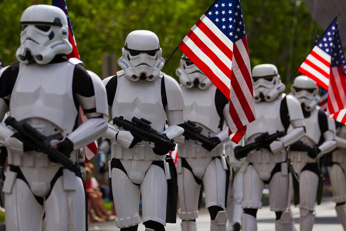 A fan favorite is “The Fourth Awakens,” featuring the Neon City Garrison Star Wars costumin ...