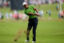 Tiger Woods hits from the rough on the second hole during the second round of the PGA Champions ...