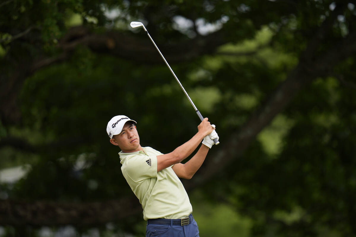 Collin Morikawa watches his shot on the sixth hole during the third round of the U.S. Open golf ...