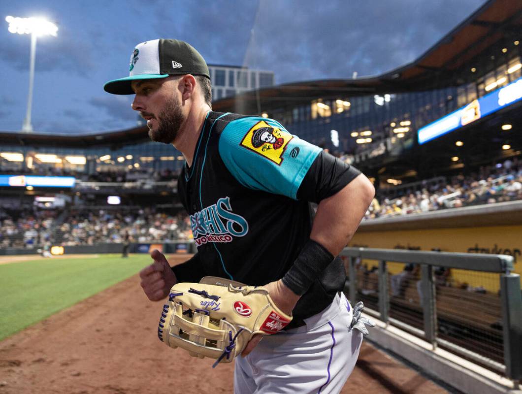 Colorado Rockies third baseman Kris Bryant takes the field during a rehab assignment with the A ...