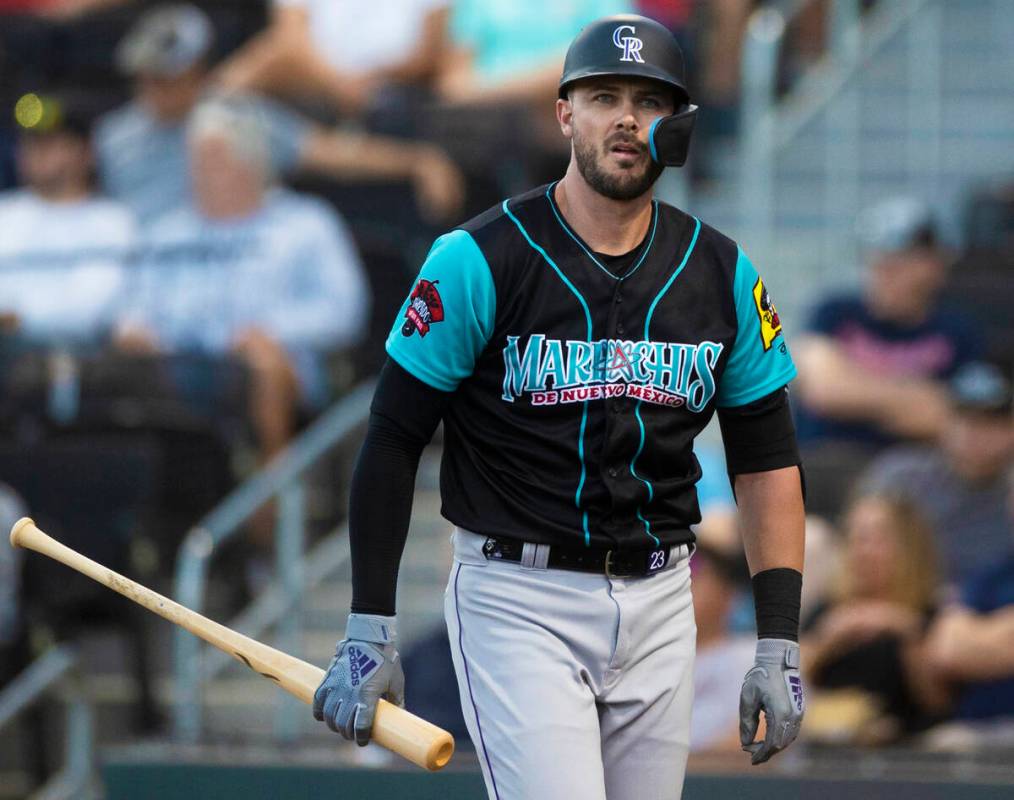 Colorado Rockies third baseman Kris Bryant walks back to the bench during a rehab assignment wi ...