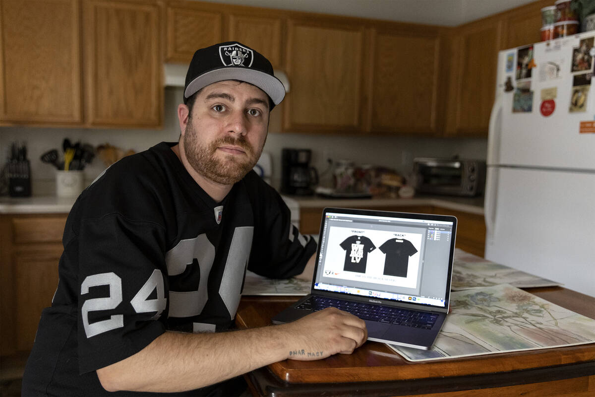 Matthew Proscia, who worked for The Raider Image, LLC, shows designs he had hoped to showcase t ...