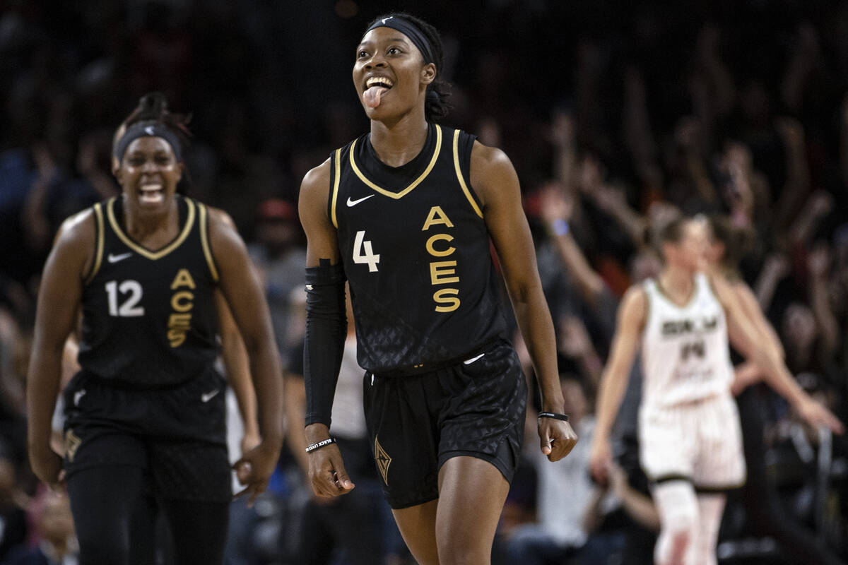 Las Vegas Aces guard Aisha Sheppard (4) and guard Chelsea Gray (12) celebrate after Sheppard sc ...