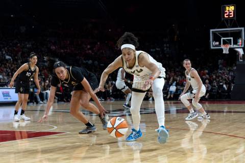 Las Vegas Aces forward Dearica Hamby (5) and Chicago Sky forward Candace Parker (3) run for the ...
