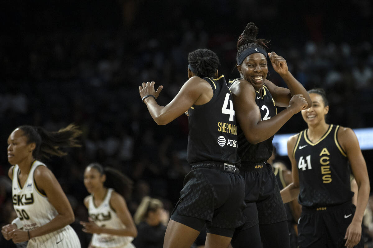 Las Vegas Aces guard Aisha Sheppard (4) and guard Chelsea Gray (12) celebrate after Sheppard sc ...