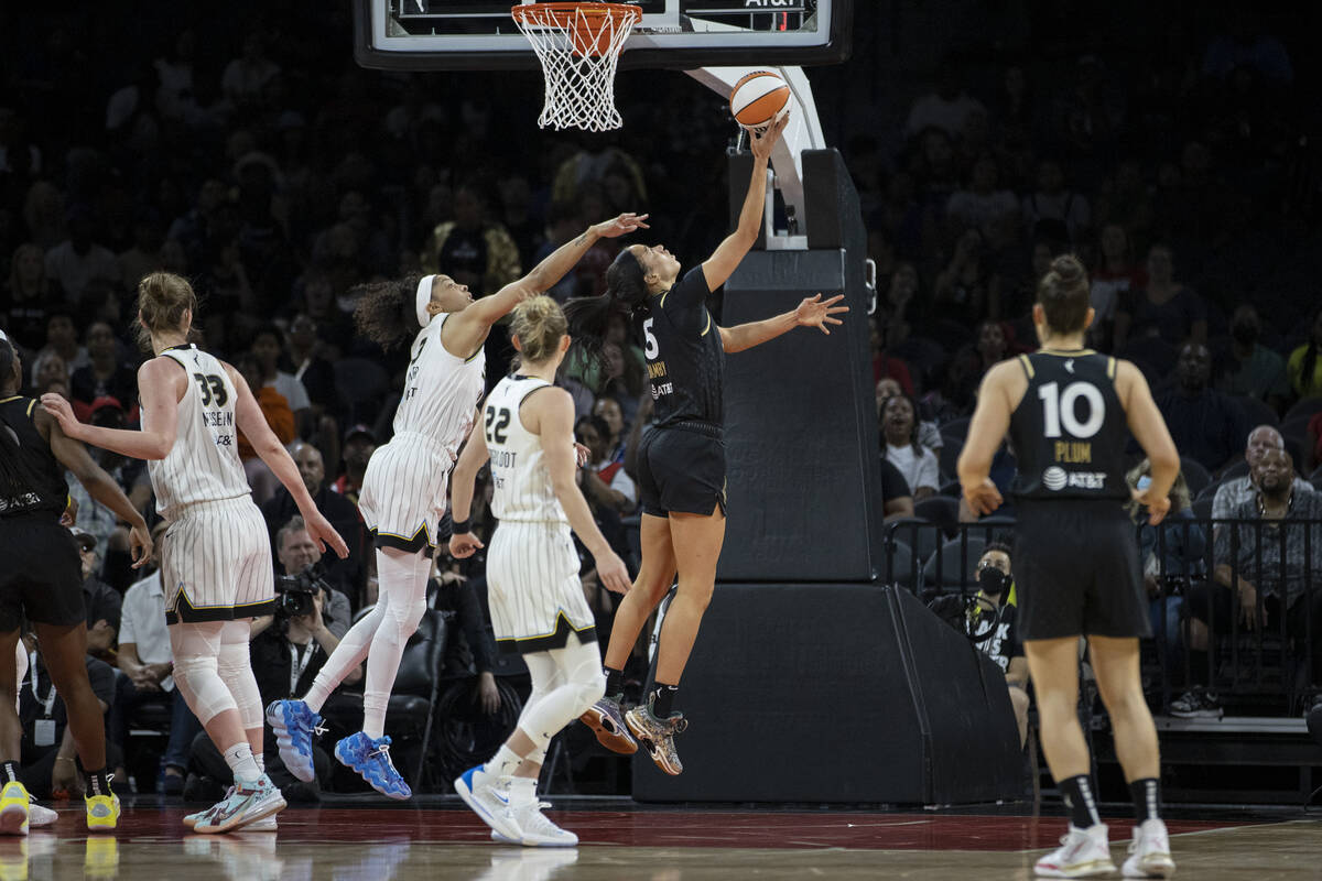 Las Vegas Aces forward Dearica Hamby (5) shoots against Chicago Sky forward Candace Parker (3) ...