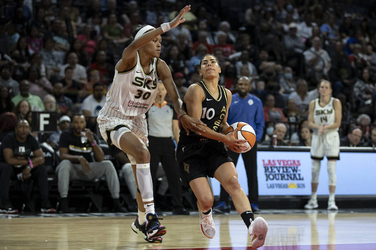 Las Vegas Aces guard Kelsey Plum (10) runs to shoot against Chicago Sky forward Azura Stevens ( ...