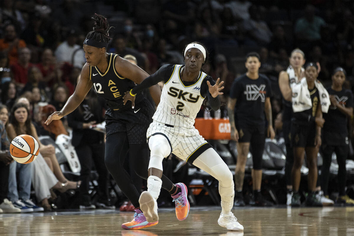Las Vegas Aces guard Chelsea Gray (12) gains control of the ball from Chicago Sky guard Kahleah ...