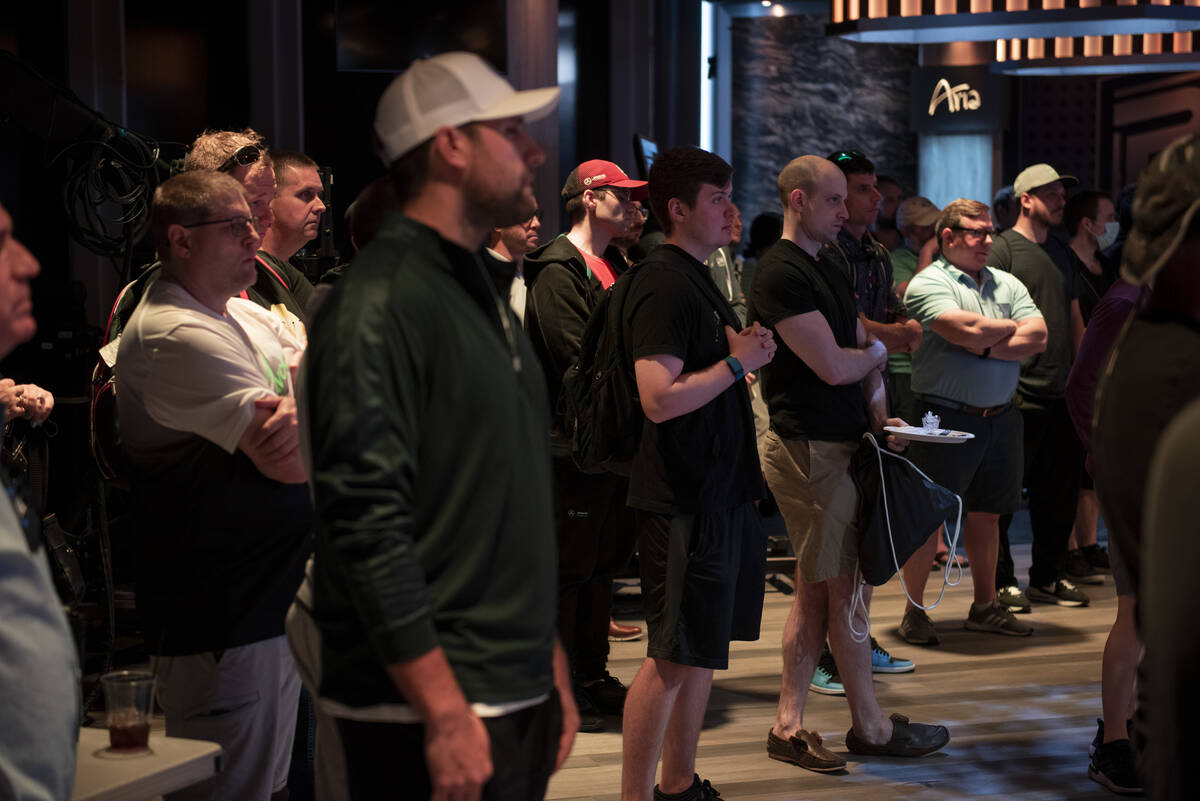 Poker players listen to an introduction and get information about their games at the PokerGO st ...