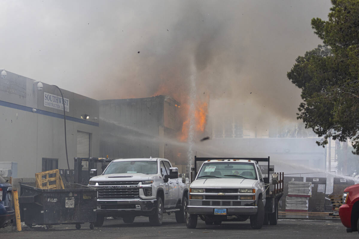 Clark County firefighters battle a fire at a warehouse just west of the Las Vegas Strip on Wedn ...