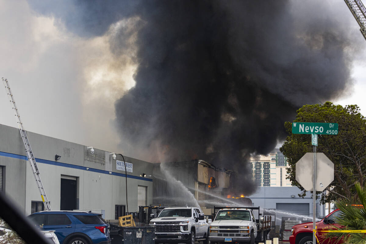 Clark County firefighters battle a fire at a warehouse just west of the Las Vegas Strip on Wedn ...