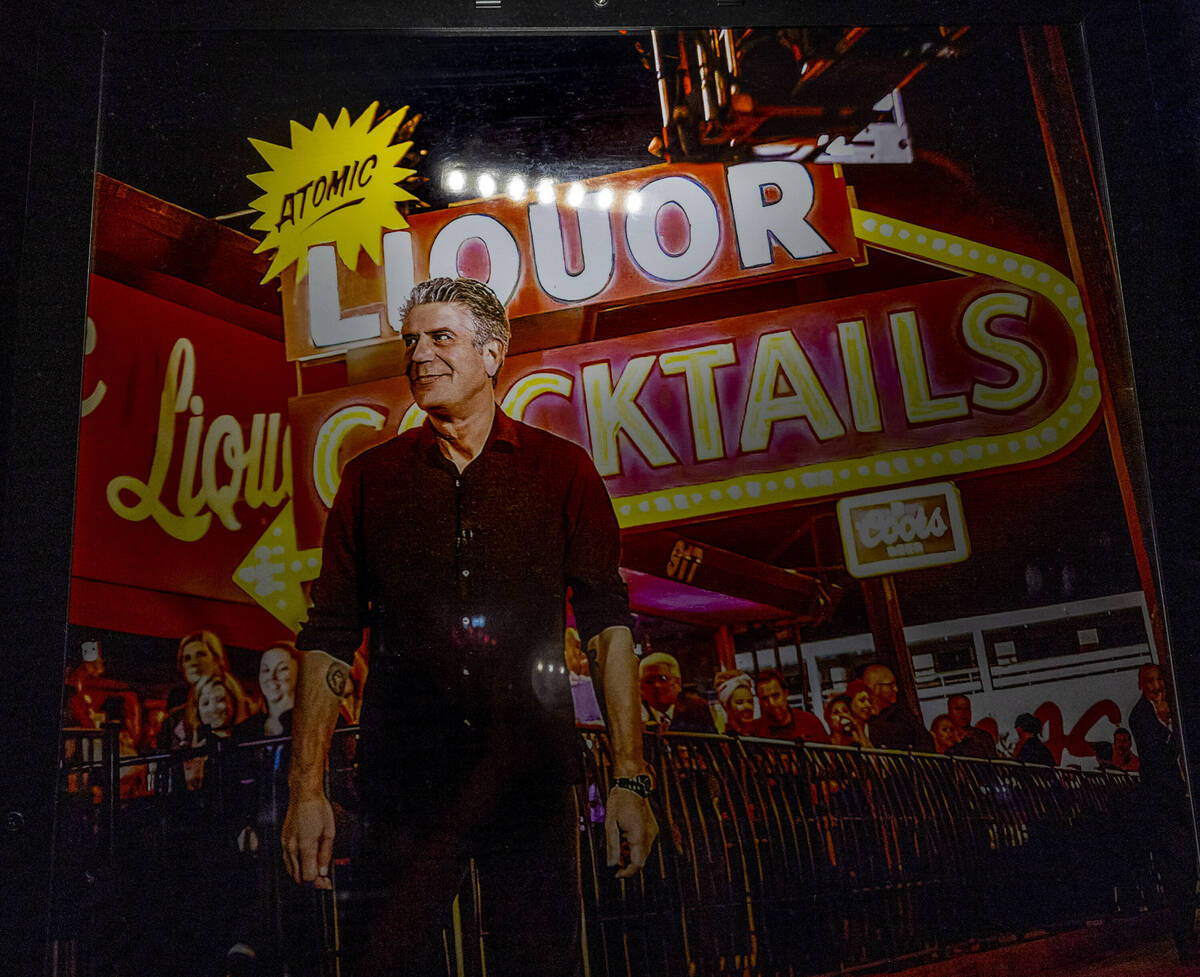 A poster of Anthony Bourdain hangs near the bar commemorating his visit to Atomic Liquors, the ...