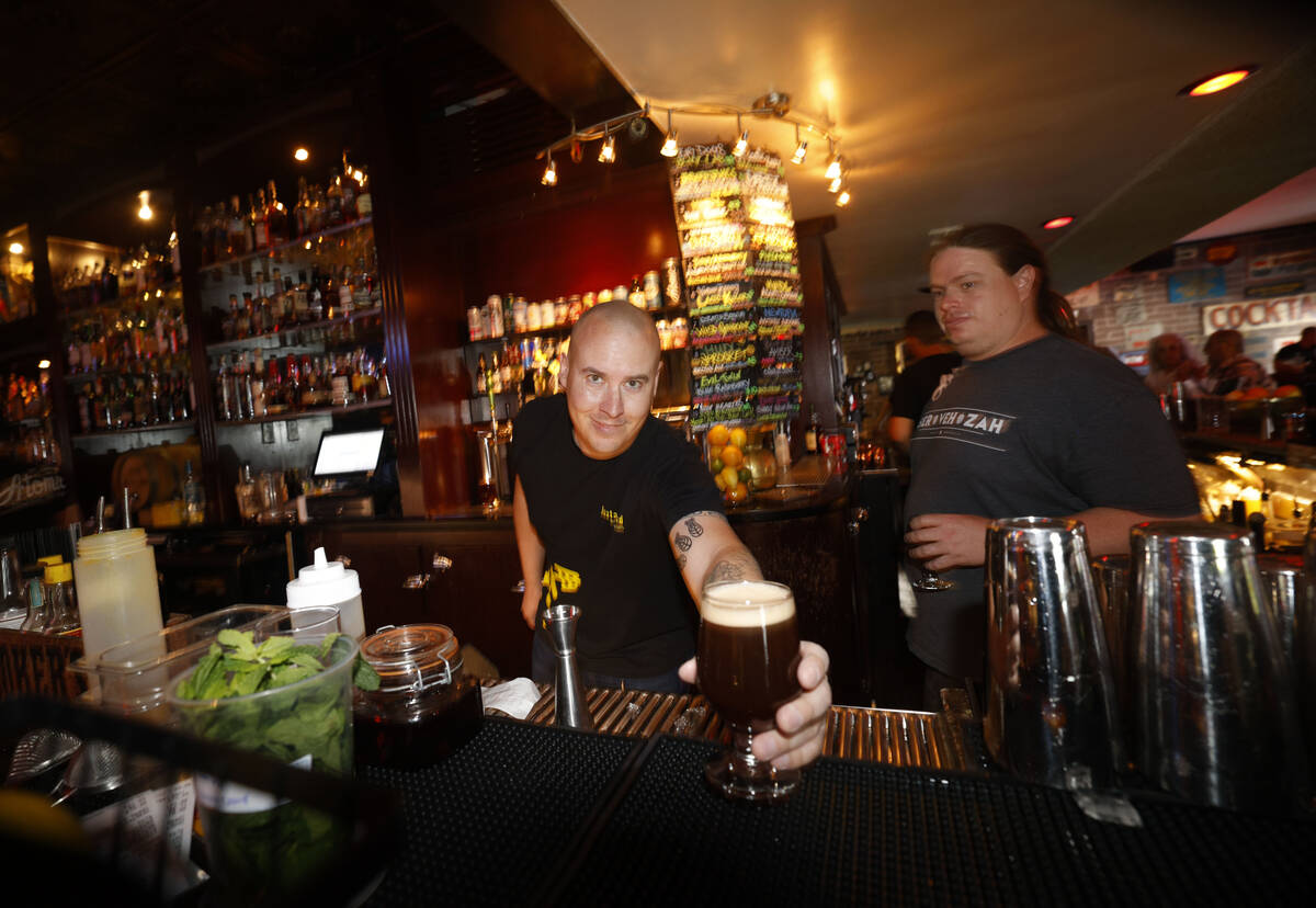Kyle Weniger, former head brewer of Joseph James Brewing Co., left, shows a glass of Joseph Jam ...
