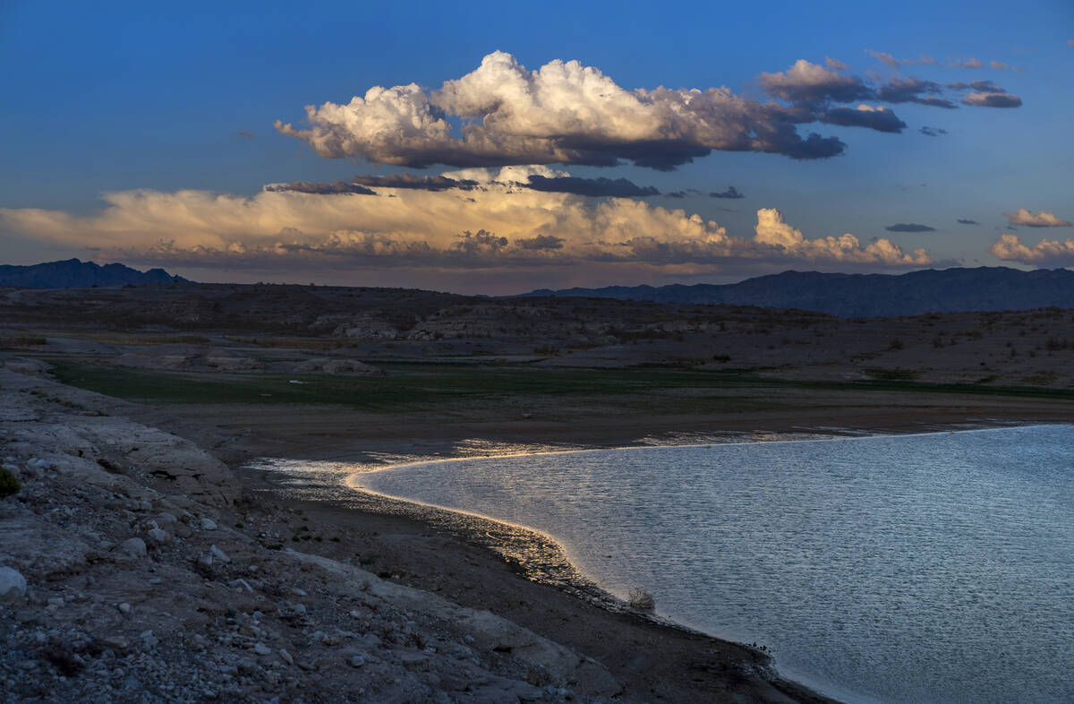 The late-day light illuminates the shoreline as water levels continue to drop at the Lake Mead ...