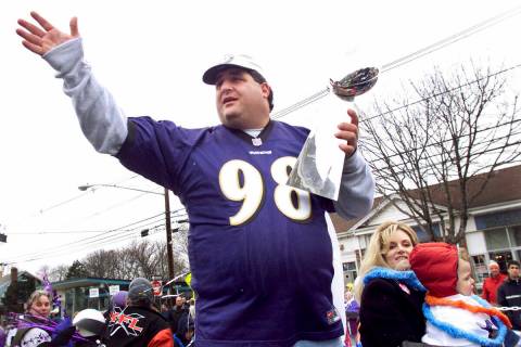 Tony Siragusa, defensive tackle for the Super Bowl-champion Baltimore Ravens, holds the Vince L ...