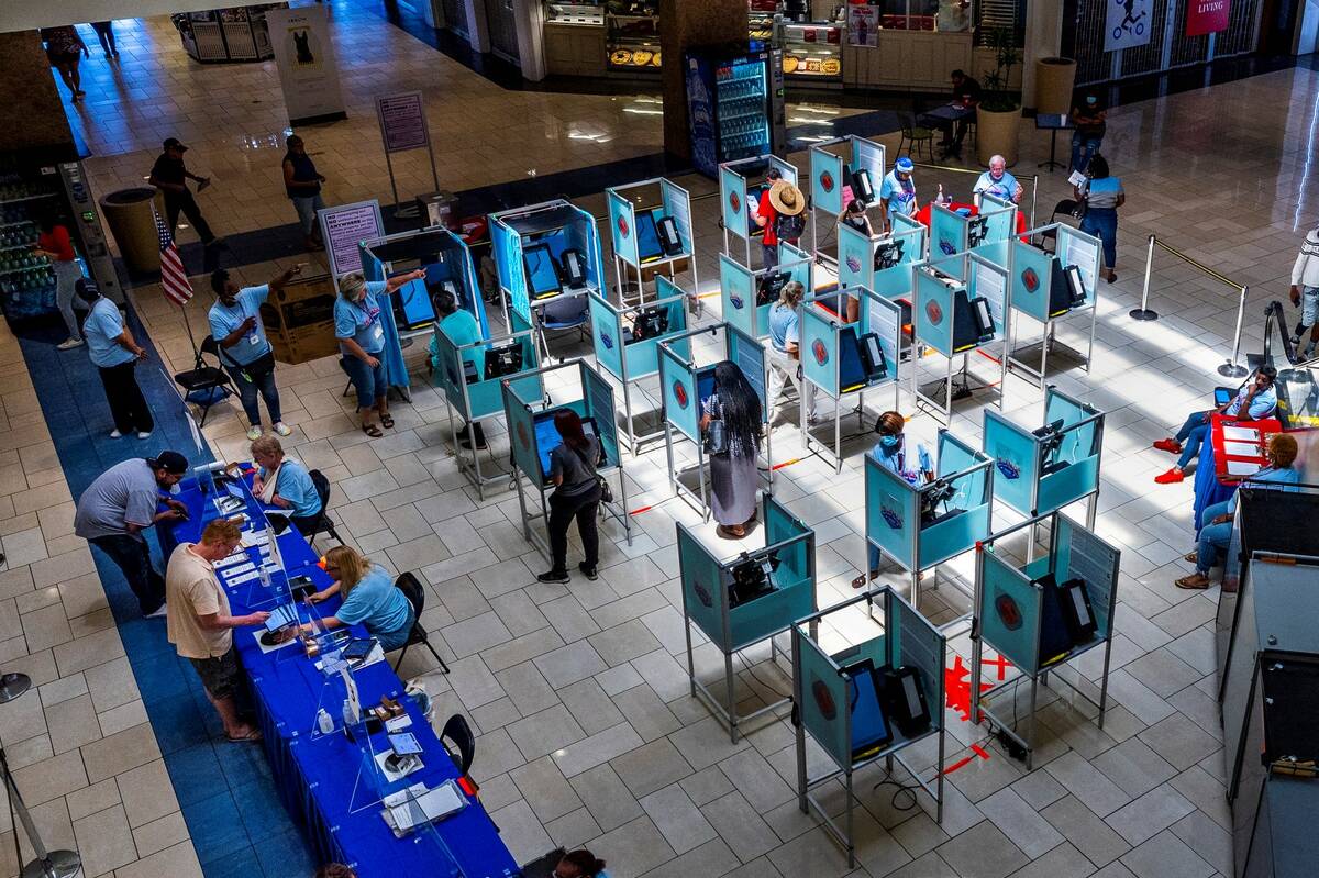 Residents participate in the last day of early voting for the 2022 primaries at Meadows Mall on ...
