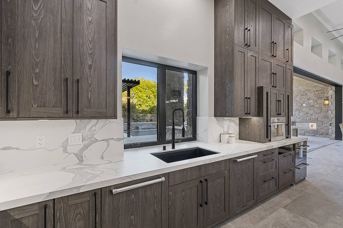 The kitchen has plenty of cabinets. (Darin Marques Group)