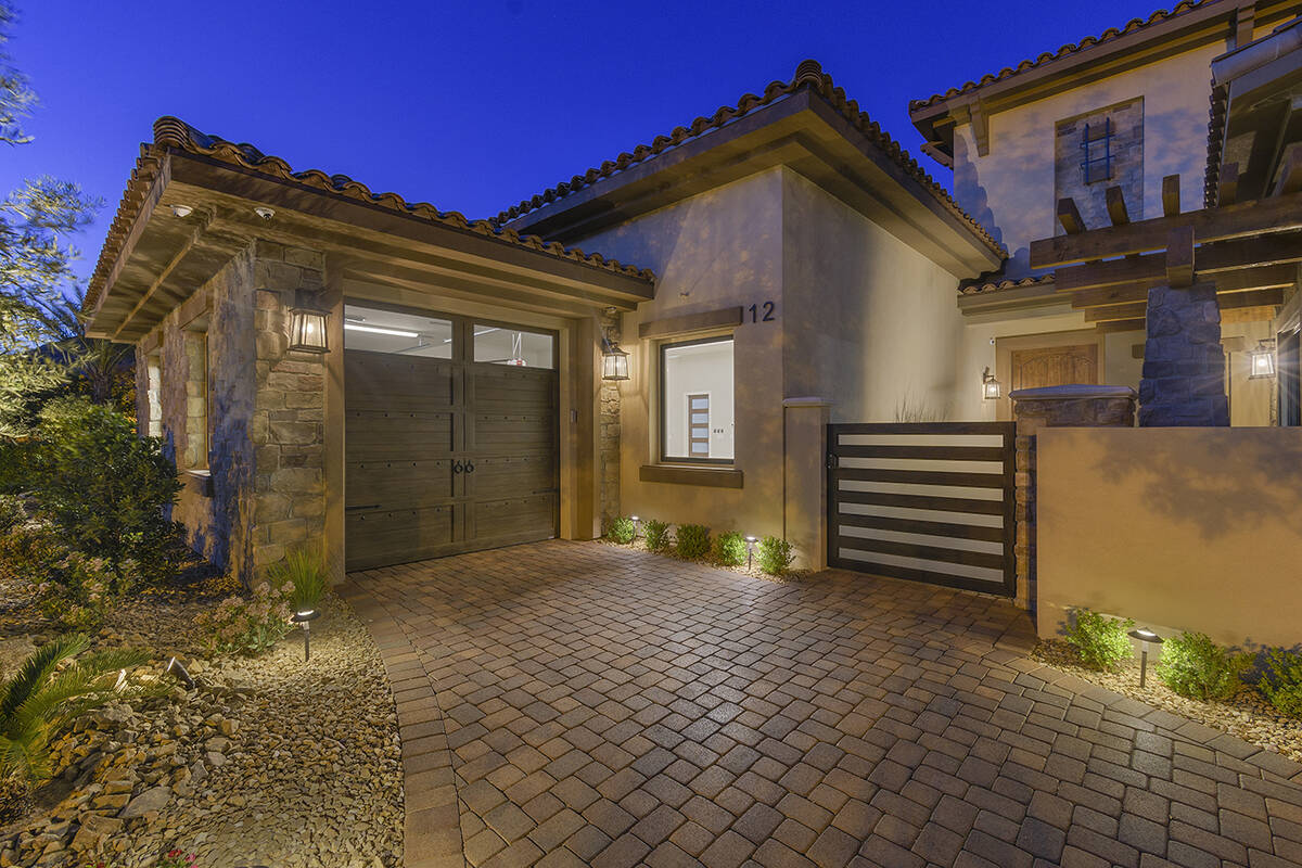 The attached five-car garage has a drive-thru bay and foundation for a two-post car lift. (Dari ...