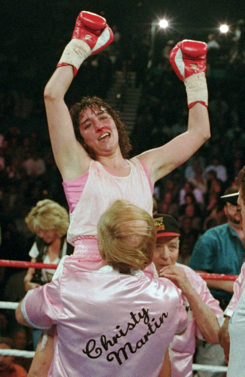 Three-time world champion Christy Martin, of Orlando, Fla., celebrates her victory over Deirdre ...