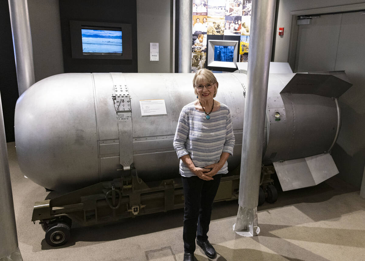 Jeanne Sharp Howerton poses for a photo next to the casing of B-53 thermonuclear weapon at the ...