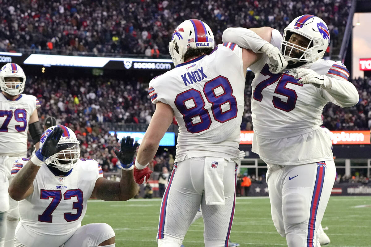 Buffalo Bills tight end Dawson Knox (88) celebrates with offensive tackle Daryl Williams (75) a ...